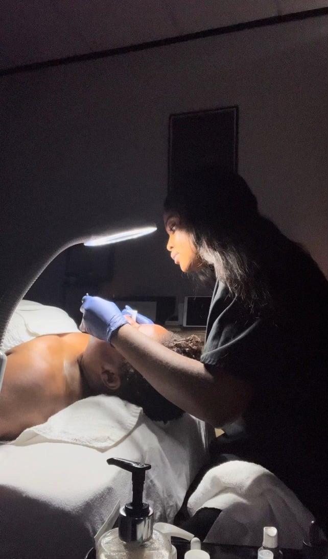 Teekay treating a client in the studio